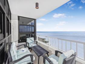 Beachfront condo with panoramic ocean views and pool