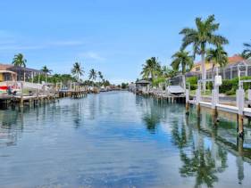 Waterfront home with pool and foosball table