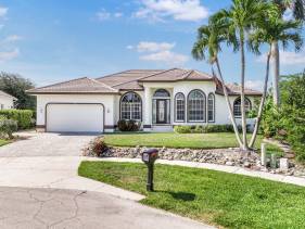 Waterfront home on key lot with pool and sundeck