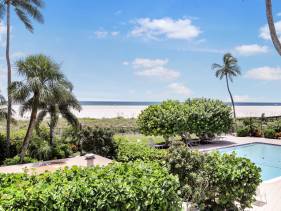 Bungalow-style beachfront condo with pool