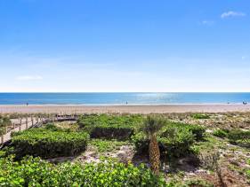 Gated beachfront condo with nice views, pools and gym