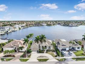 Waterfront home with views, pool and walk to beach