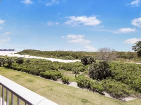 Beachfront condo with pool and wraparound balcony