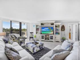 Beachfront condo in resort-style community with pool