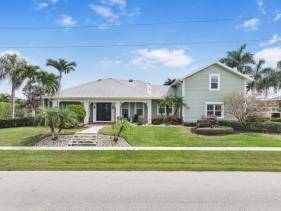 Coastal two-story home on water with pool/dock