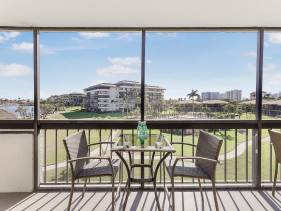 Condo with pool, view of Clam Bay and walk to beach