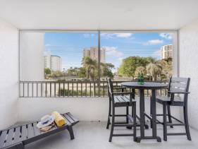 Relaxing inland condo with pool and steps to beach