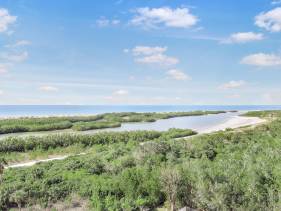 Beachfront condo with views of beach, pool and grill