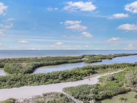 Elegant beachfront condo in private community
