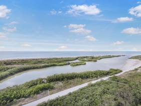 Front beachfront condo with pool, fitness and grills