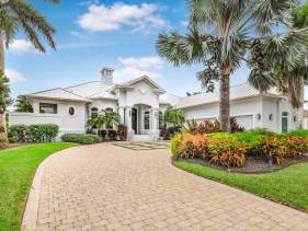 Opulent golf front home with SW-facing lanai and pool