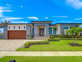 Modern home with outdoor kitchen and steps to beach