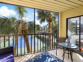 Island-style riverfront condo with pools and spas
