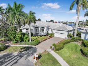 Waterfront home on key lot with pool, spa and views