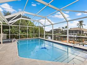 W exposure waterfront home with pool, spa and dock
