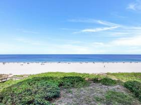 Ideally situated beachfront condo with pool and views