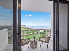 Beachfront condo with views of beach and spacious pool