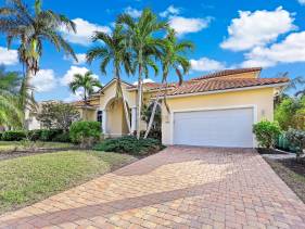 Large waterfront home with all-day sun on pool