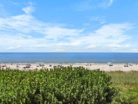 Unmatched beachfront condo with roomy balcony and pool