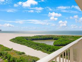 Alluring beachfront condo with pool and ocean views