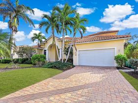 Large waterfront home with all-day sun on pool