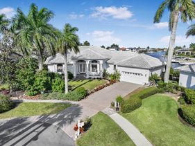 Waterfront home on key lot with pool, spa and views