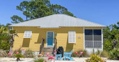 Front of Cottage, parking to the Left of wood sidewalk