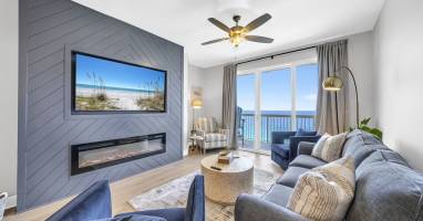 Nights are cozy around this electric fireplace & 65" smart TV paired with that breathtaking view!
