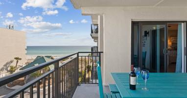 There is a large picnic table for al fresco dining with views of the beach.