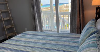 King Bedroom on Main level-Gulf Views. Great views of gulf and access to deck.