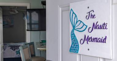 Step inside The Nauti Mermaid and get your first glimpse of the space. The entry opens directly into the condo, setting the tone for a clean, well-cared-for retreat just moments from the beach.