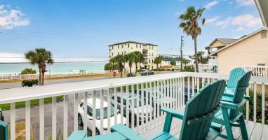Relax in our elevated polywood chairs on the balcony after a day at the beach.