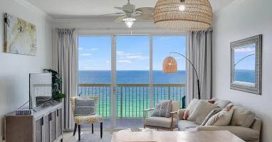 Spacious living room with stunning turquoise Gulf views-relax in coastal comfort