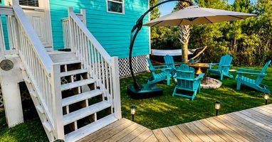 board walk up to Resting Beach Face- facing front of house with fire pit
