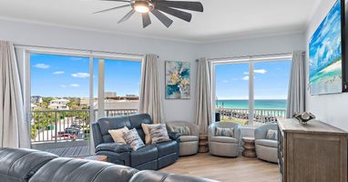 Gulf-view living room with floor-to-ceiling windows