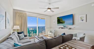 After enjoying the sun, sand and adventure, relax in your beach-inspired living room watching the 75" smart TV.