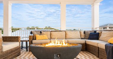 3rd floor rooftop patio that's 500sq ft, and has a rooftop fire pit, dining for 16, outdoor TV, grill, and beverage fridge