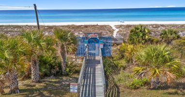 Walk out your gate, follow the palm-shaded boardwalk, and
step onto the sand. Your private Bid-A-Wee beach
access puts the Gulf just minutes from the back door.