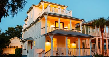 The property glows at night — a glimpse of the ambiance waiting for your group after a day on 30A.