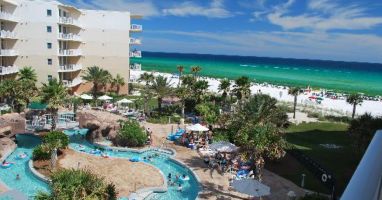 Amazing view of courtyard pools and Gulf from balcony, Lazy River