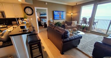 LR has 65 in. Smart TV &amp; great a view of gulf. Bar has 4 stools for add'l seats!