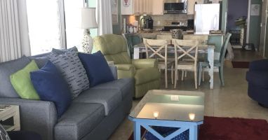 Living area flows from kitchen thro dining onto huge wrap around balcony