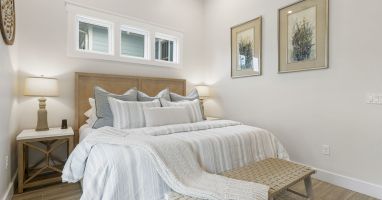 Luxury King Bed with Luxury Cotton Linens- Cell phone chargers on nightstand