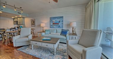 Living area with ceiling fans track lighting!