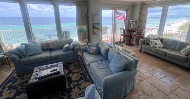 Living room with access to our wrap around balcony &amp; view of Gulf &amp; beach
