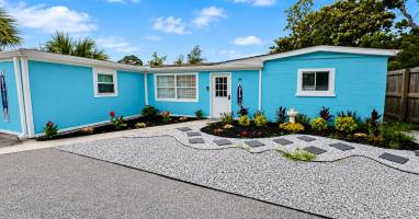 Front of the home with plenty of parking
