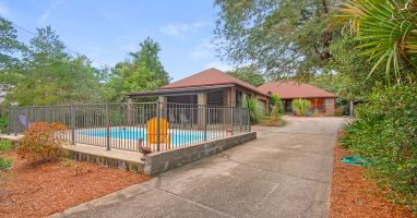 Pool with covered patio for grilling and enjoying family outdoors