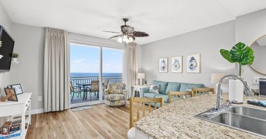 Living Room: Enjoy stunning ocean views and bright d&eacute;cor in this inviting space space!