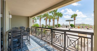 Ground-floor Gulf views with direct beach walkout.