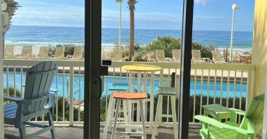 LIFE IS GOOD on this balcony with 2 table sets and Adirondack chair. TOYS TOO!